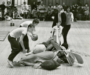 Grand Union performance to benefit te Committee to Defend the Black Panthers, 1971, L to R: Becky Arnold, Nancy Lewis, Barbara Dilley, Douglas Dunn, Yvonne Rainer; under cover: Steve paxton, David Gordon. Photo © Peter Moore